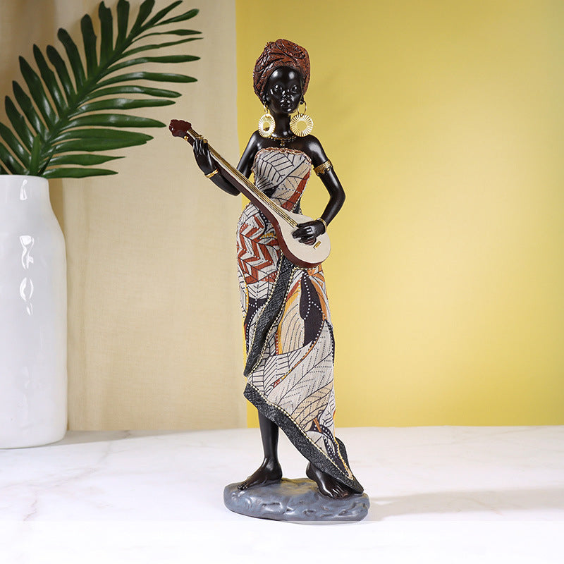 Afrikaanse vrouwelijke muzikant sculptuur