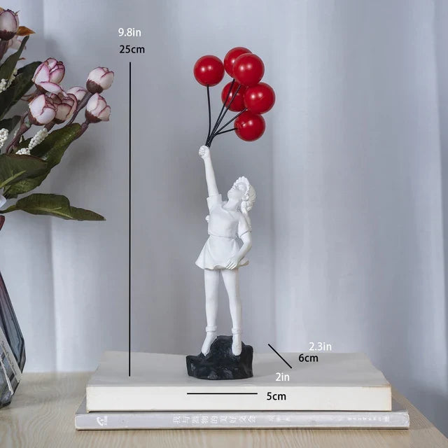 Beeldhouwwerk van een meisje met een ballon in Banksy-stijl voor tafeldecoratie en creatieve woonkamerdecoratie
