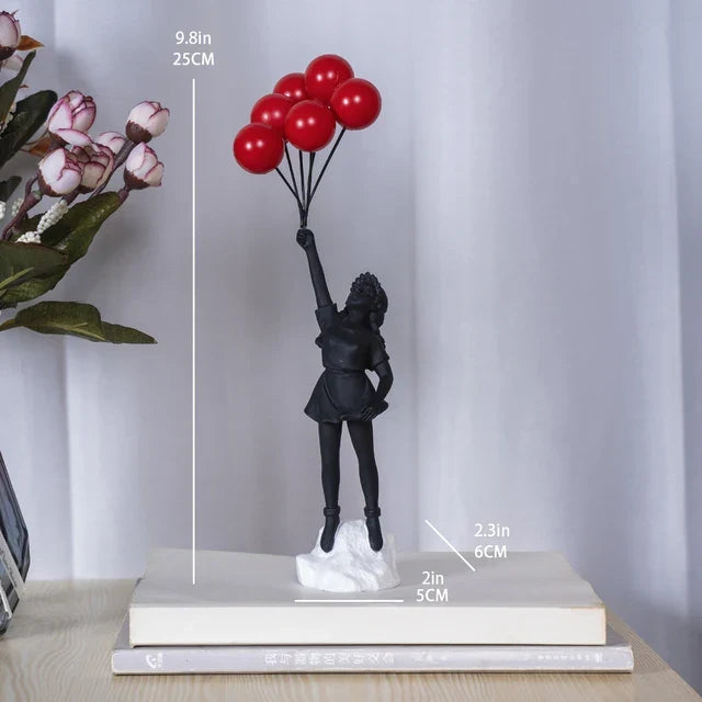 Beeldhouwwerk van een meisje met een ballon in Banksy-stijl voor tafeldecoratie en creatieve woonkamerdecoratie