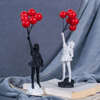 Beeldhouwwerk van een meisje met een ballon in Banksy-stijl voor tafeldecoratie en creatieve woonkamerdecoratie