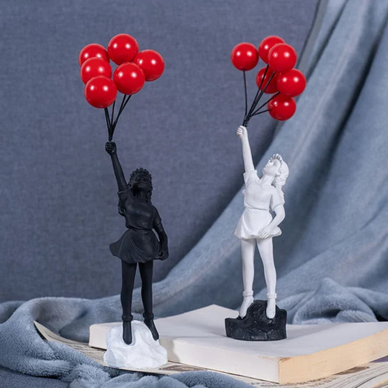 Beeldhouwwerk van een meisje met een ballon in Banksy-stijl voor tafeldecoratie en creatieve woonkamerdecoratie