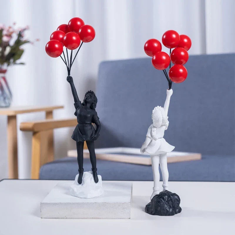 Beeldhouwwerk van een meisje met een ballon in Banksy-stijl voor tafeldecoratie en creatieve woonkamerdecoratie