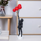 Beeldhouwwerk van een meisje met een ballon in Banksy-stijl voor tafeldecoratie en creatieve woonkamerdecoratie