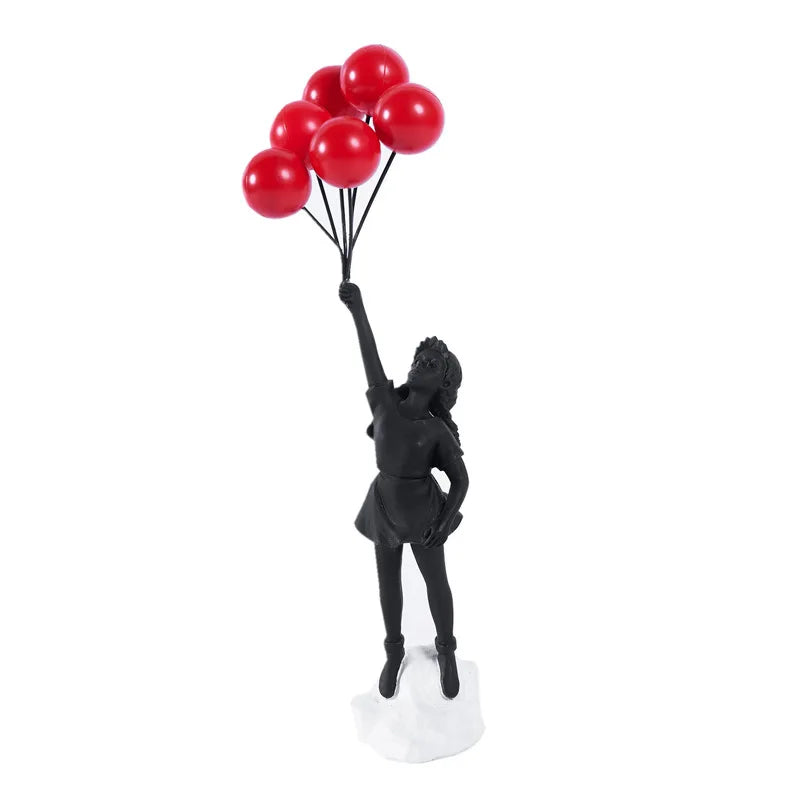 Beeldhouwwerk van een meisje met een ballon in Banksy-stijl voor tafeldecoratie en creatieve woonkamerdecoratie